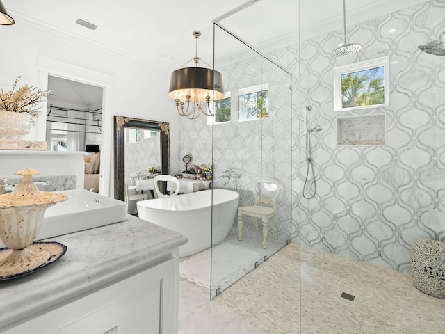 bathroom with visible vents, a soaking tub, ornamental molding, vanity, and a walk in shower