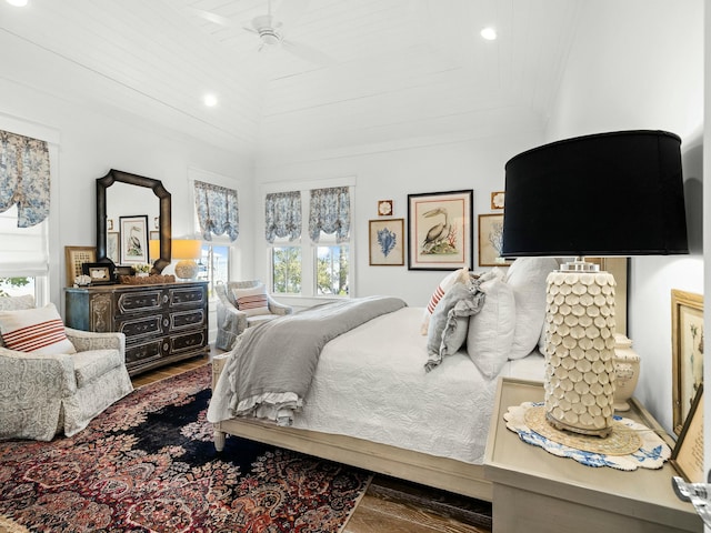 bedroom featuring ceiling fan, lofted ceiling, recessed lighting, wood finished floors, and crown molding