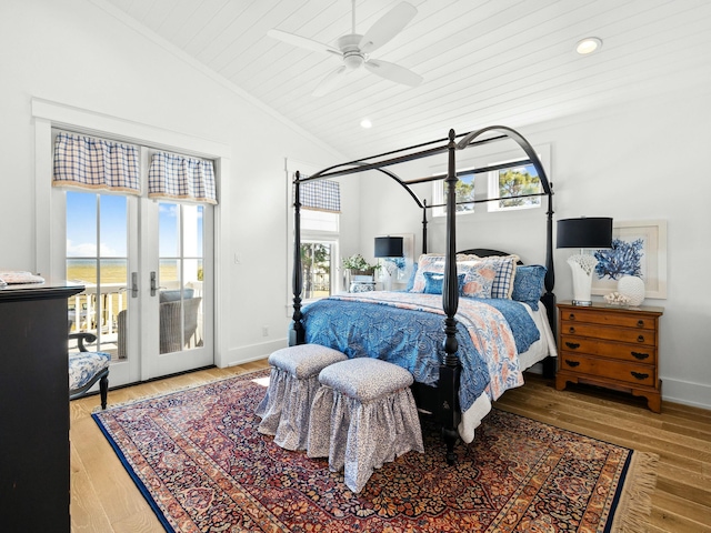 bedroom with lofted ceiling, baseboards, access to outside, ornamental molding, and wood-type flooring