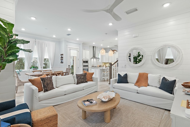 living room featuring recessed lighting, visible vents, stairway, a ceiling fan, and light wood-type flooring