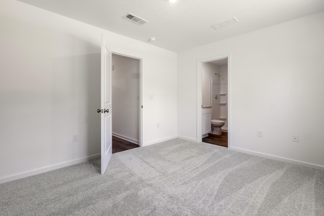781 Girl Scout Rd, Defuniak Springs, FL 32433 - unfurnished bedroom featuring carpet floors, baseboards, and connected bathroom