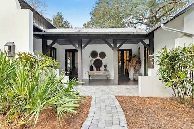 property entrance featuring french doors