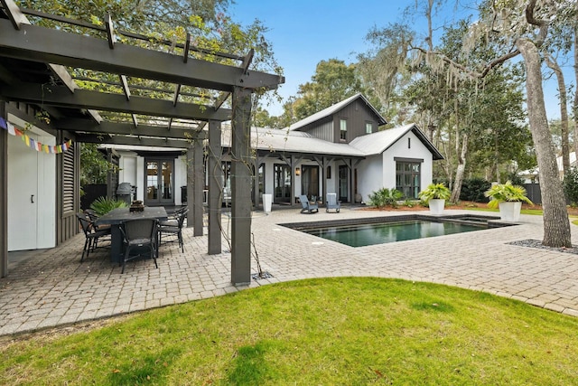 view of swimming pool with french doors, a patio, a yard, and a pergola