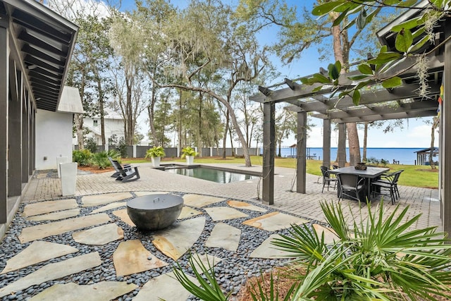 view of patio / terrace with a water view, a fenced in pool, and a pergola