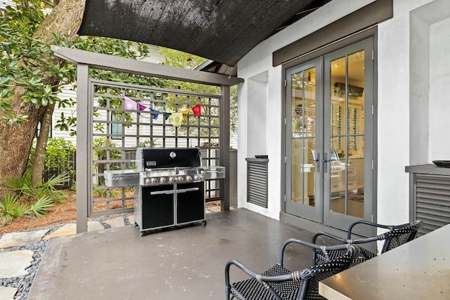 view of patio / terrace featuring a grill and french doors