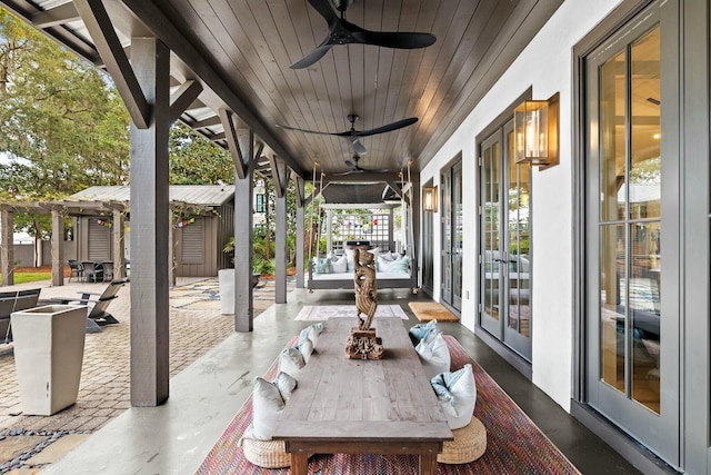 view of patio / terrace featuring french doors and ceiling fan