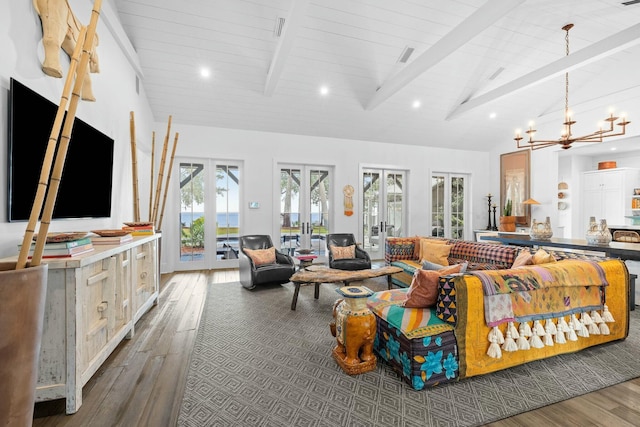 living room featuring beamed ceiling, hardwood / wood-style floors, high vaulted ceiling, and french doors