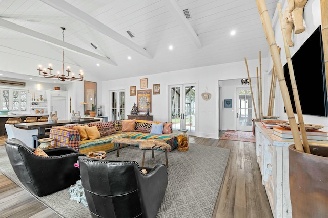 living room with french doors, beam ceiling, high vaulted ceiling, and light hardwood / wood-style flooring