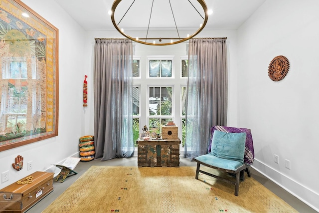 sitting room with an inviting chandelier