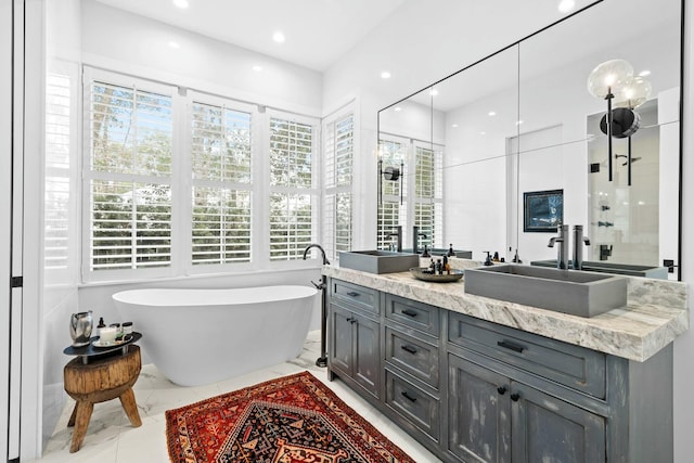 bathroom with vanity and a tub to relax in