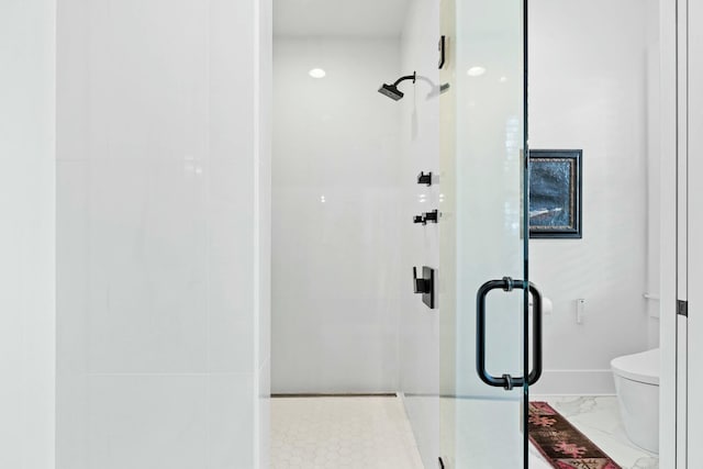 bathroom with walk in shower and toilet