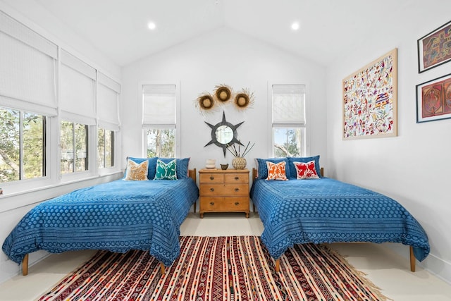 bedroom featuring lofted ceiling