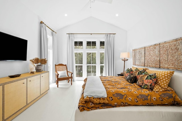 bedroom featuring ceiling fan, lofted ceiling, and hardwood / wood-style floors