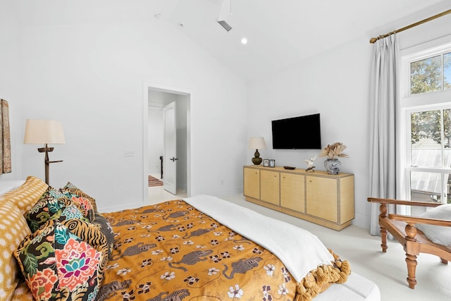 bedroom with light carpet and high vaulted ceiling