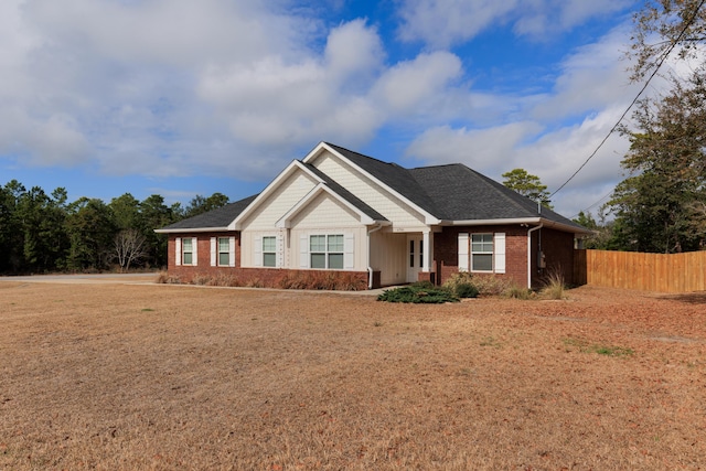 craftsman-style house with a front lawn