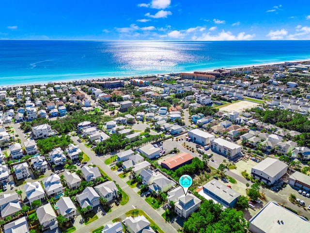 bird's eye view with a beach view, a water view, and a residential view