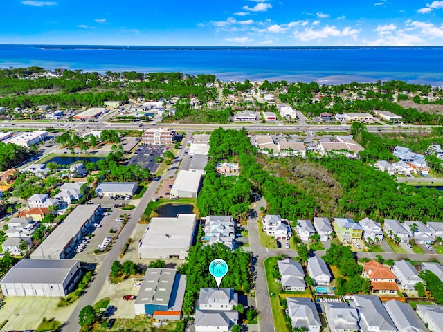 drone / aerial view featuring a residential view and a water view