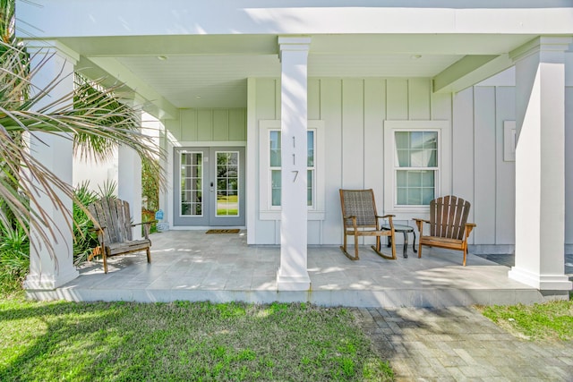 doorway to property featuring board and batten siding and french doors