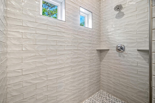 bathroom featuring tiled shower