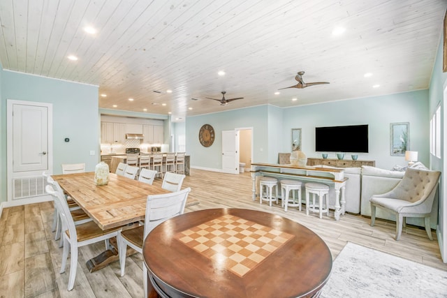 dining area with light wood-type flooring, recessed lighting, wood ceiling, and ceiling fan