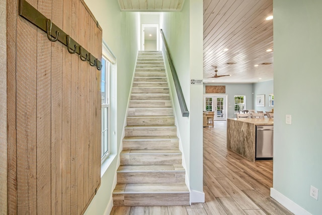 stairway with baseboards, a ceiling fan, wooden ceiling, wood finished floors, and recessed lighting