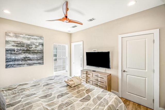 bedroom with recessed lighting, visible vents, ceiling fan, and wood finished floors