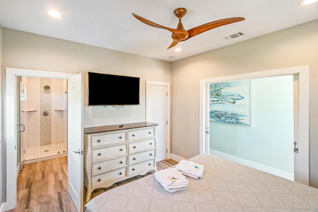 bedroom with light wood-style flooring, recessed lighting, visible vents, baseboards, and ensuite bath