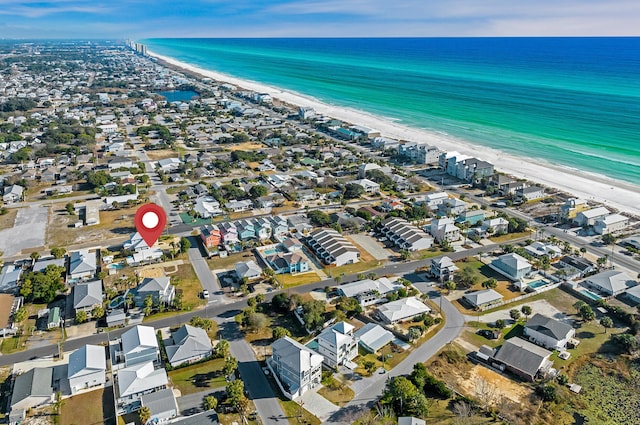 bird's eye view with a water view and a view of the beach