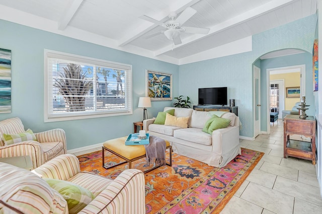 living room with lofted ceiling with beams, light tile patterned flooring, and ceiling fan