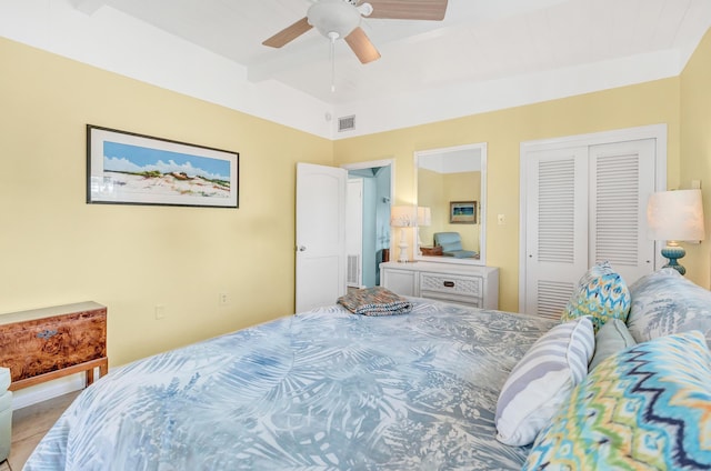 bedroom featuring vaulted ceiling, ceiling fan, and a closet