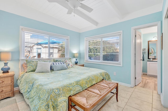 tiled bedroom featuring beamed ceiling and ceiling fan