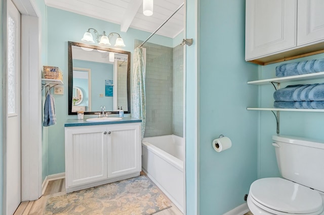 full bathroom featuring vanity, toilet, beam ceiling, and shower / bath combo with shower curtain