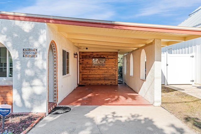 exterior space with a carport