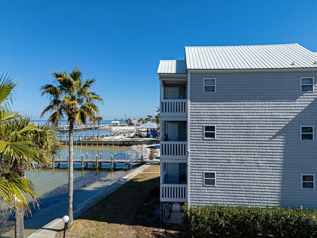 view of dock featuring a balcony and a water view