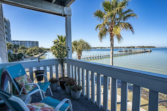 balcony featuring a water view