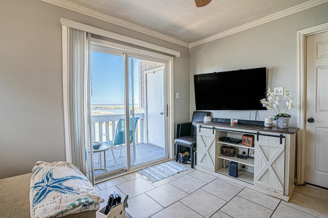 tiled living room featuring ornamental molding and ceiling fan