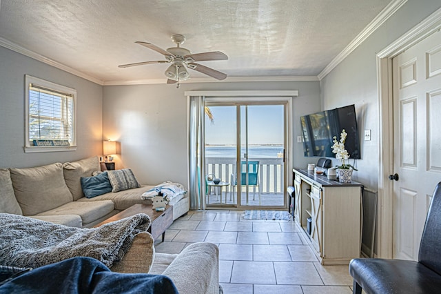 living room featuring crown molding, ceiling fan, a textured ceiling, and light tile patterned floors