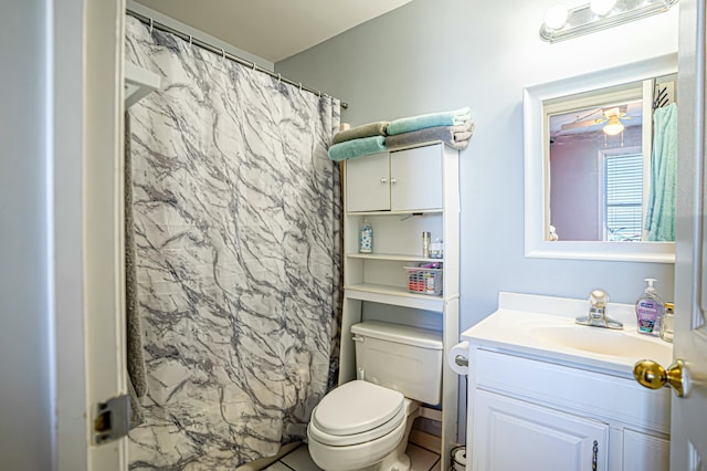 bathroom featuring vanity, curtained shower, and toilet