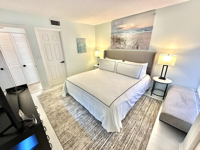4045 Beachside One Dr # 4045, Miramar Beach, FL 32550 - bedroom with a textured ceiling and a closet