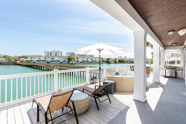 deck featuring a water view