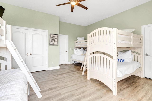 bedroom featuring light hardwood / wood-style flooring and ceiling fan