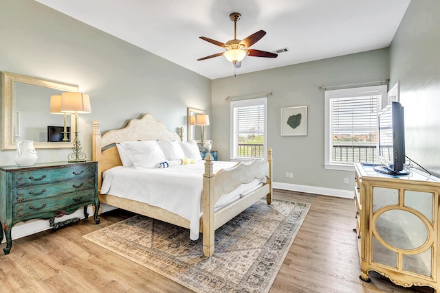 bedroom with hardwood / wood-style flooring and ceiling fan