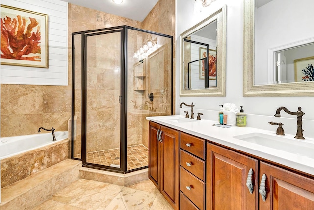 bathroom with vanity and independent shower and bath