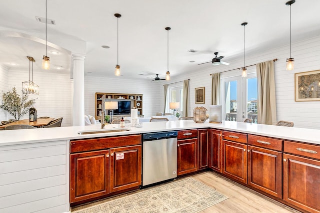 kitchen with sink, decorative light fixtures, light hardwood / wood-style flooring, stainless steel dishwasher, and ceiling fan