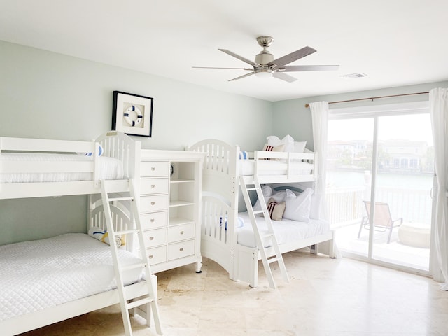 bedroom with access to exterior and ceiling fan