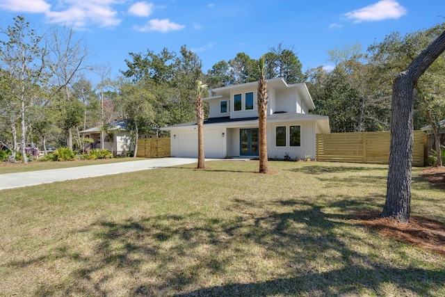 view of front of house featuring a garage, a front yard, driveway, and fence