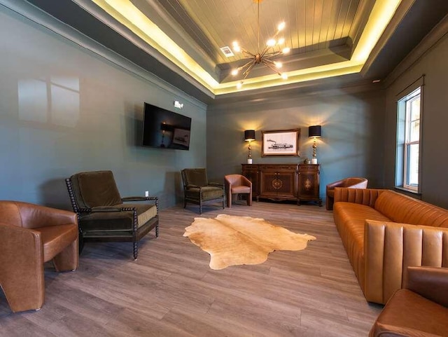 interior space with hardwood / wood-style floors, a notable chandelier, wood ceiling, and a tray ceiling