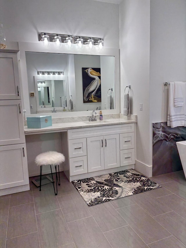 bathroom with vanity and tile patterned flooring