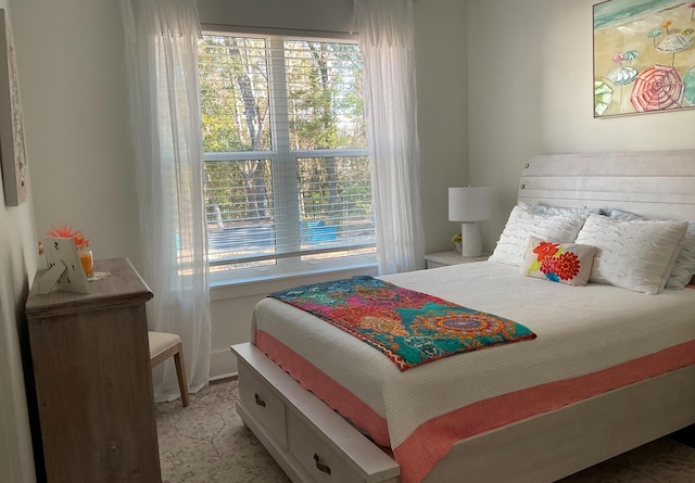 bedroom featuring multiple windows