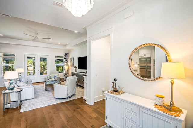 living room featuring ceiling fan, dark hardwood / wood-style flooring, and french doors